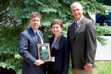 <em>Marposs Corp. President, Ed Vella (left), was presented a plaque from City of Auburn Hills City Manager, Peter Auger (right), and was recognized during the 50th Anniversary event by Dr. Maria Luisa Lapresa, Consul of Italy in Detroit, Michigan U.S.A. (center). </em>